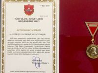 USTAOĞLUNA ALTIN MADALYA BERATI